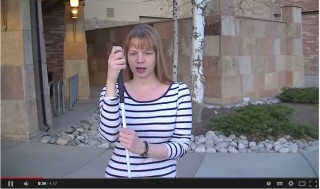 Lady showing how to use a cane